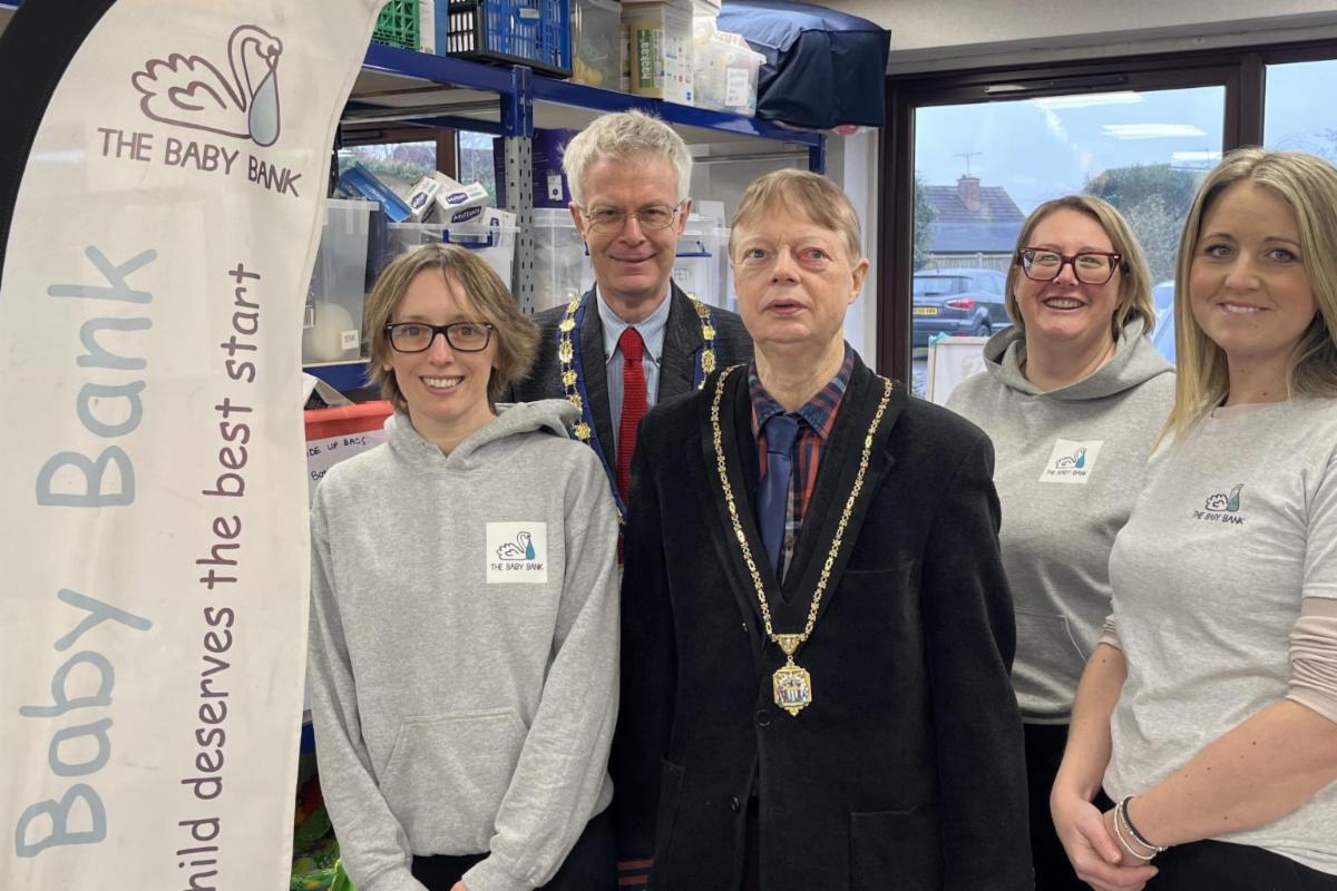 Royal Borough of Windsor and Maidenhead Mayor Simon Bond with the Mayor Consort and staff at The Baby Bank in Maidenhead